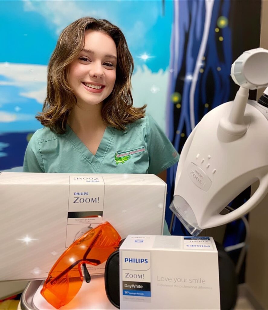 Dental assistant at Summerville Pediatric Dentistry showcases Philips Zoom teeth whitening services